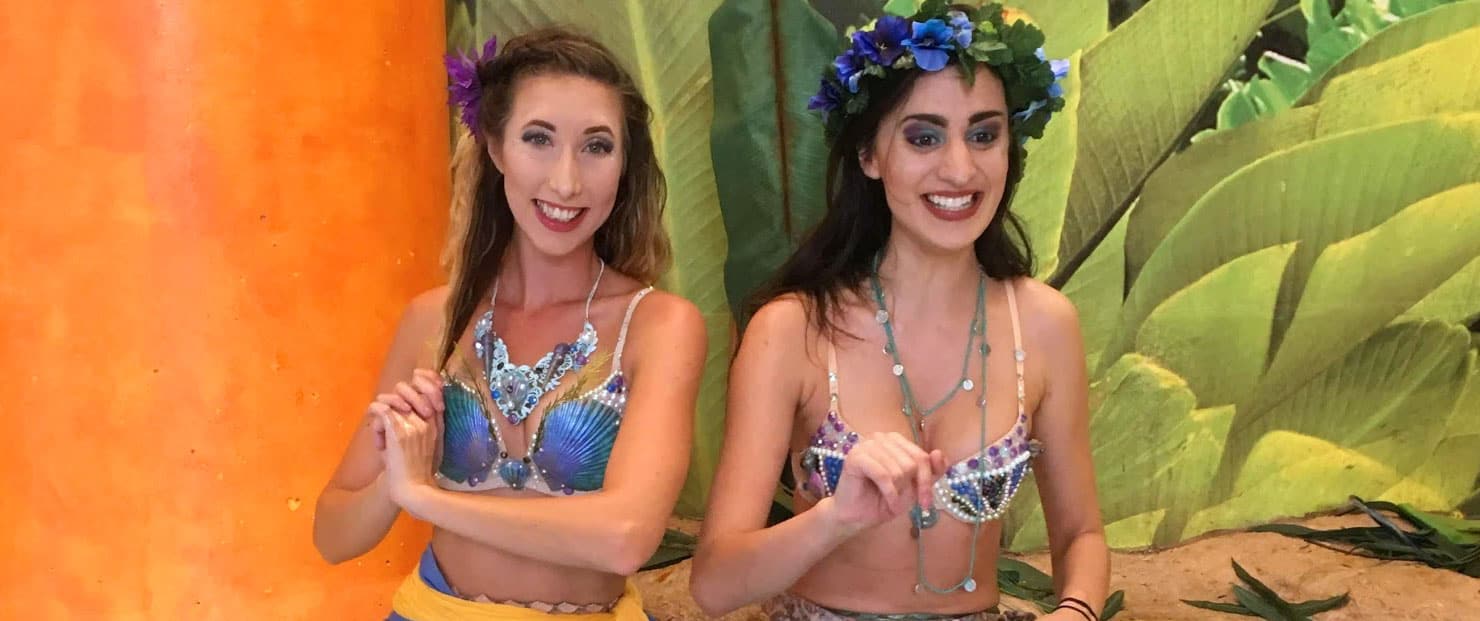 Two women in mermaid costumes