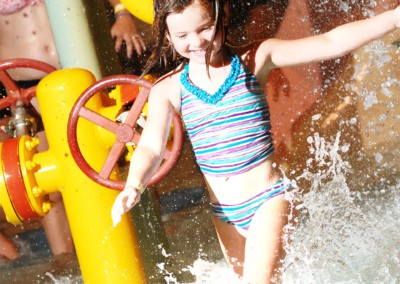 Kid splashing through the water