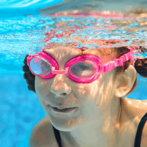 Kid underwater with goggles on