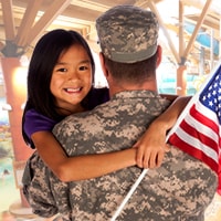 military man holding daughter at splash lagoon