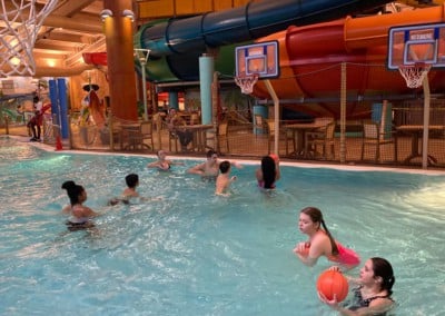 kids playing with basketballs in a pool: adventure bay