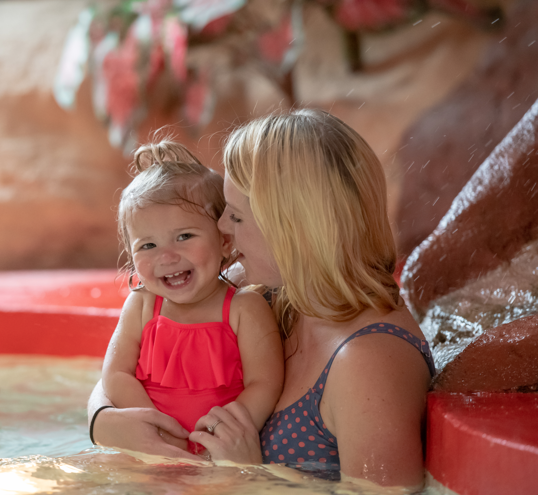 mom and daughter enjoying the hot tub