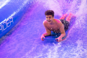 kid on surfboard riding the FlowRider