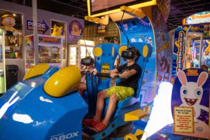 kids riding the virtual reality machine: The Big Ride